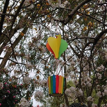 hot air balloon in front of trees