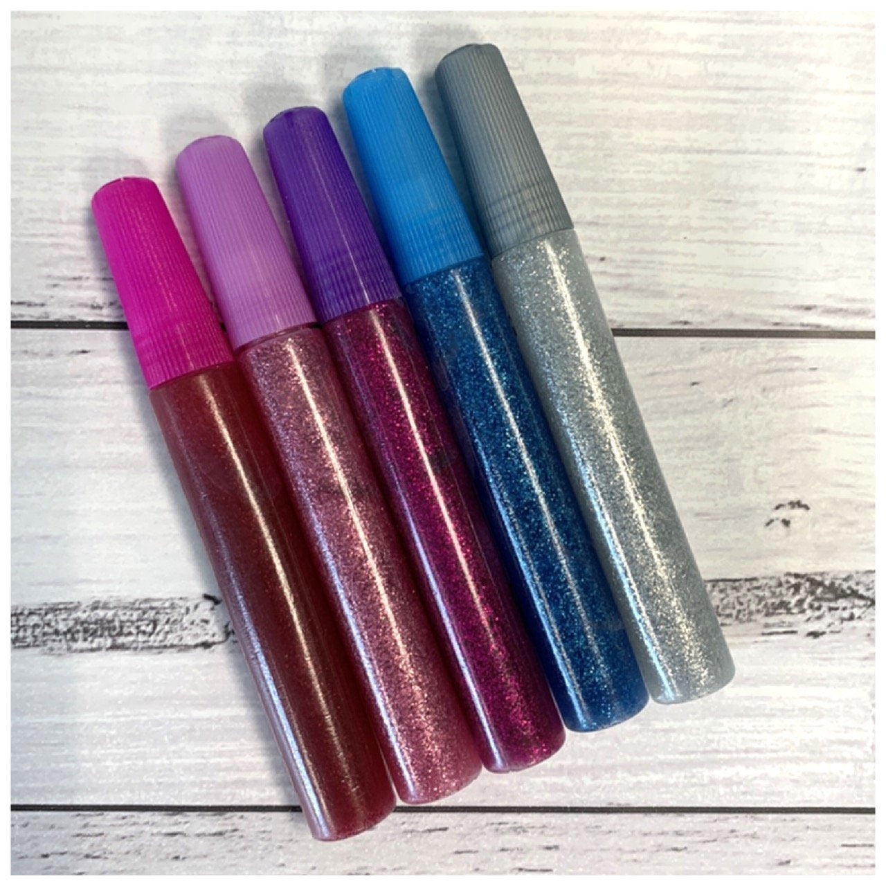 glitter glue pens pink, light pink, purple, blue and silver