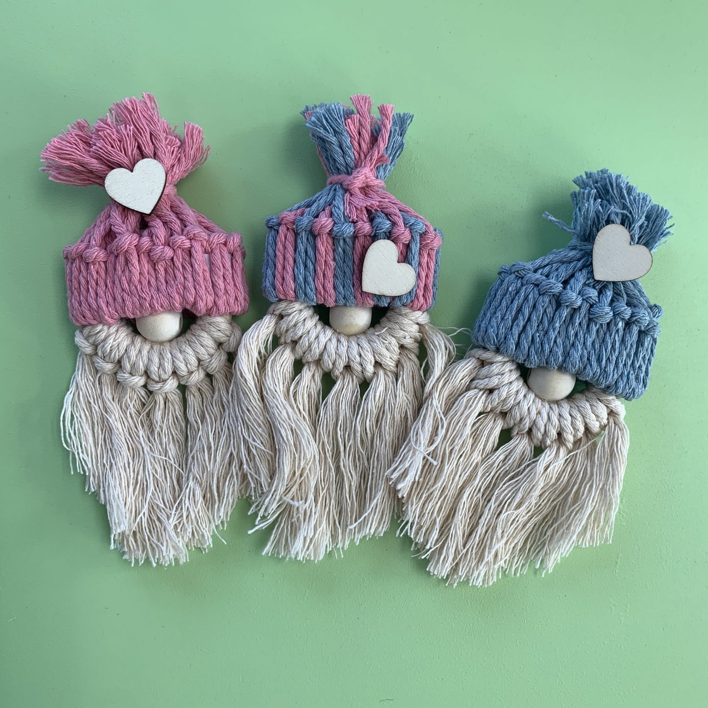 3 knotted pixie crafts with pink and blue hats