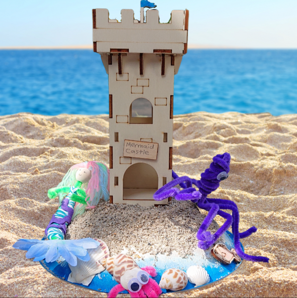 Sand castle with mermaid and octopus on a beach setting
