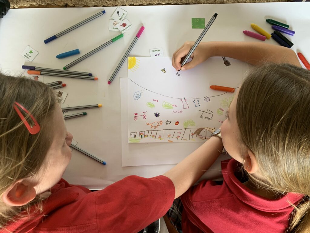 Girls drawing a garden together