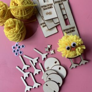 Pom pom chicken craft with yellow wool, wooden pieces, googly eyes